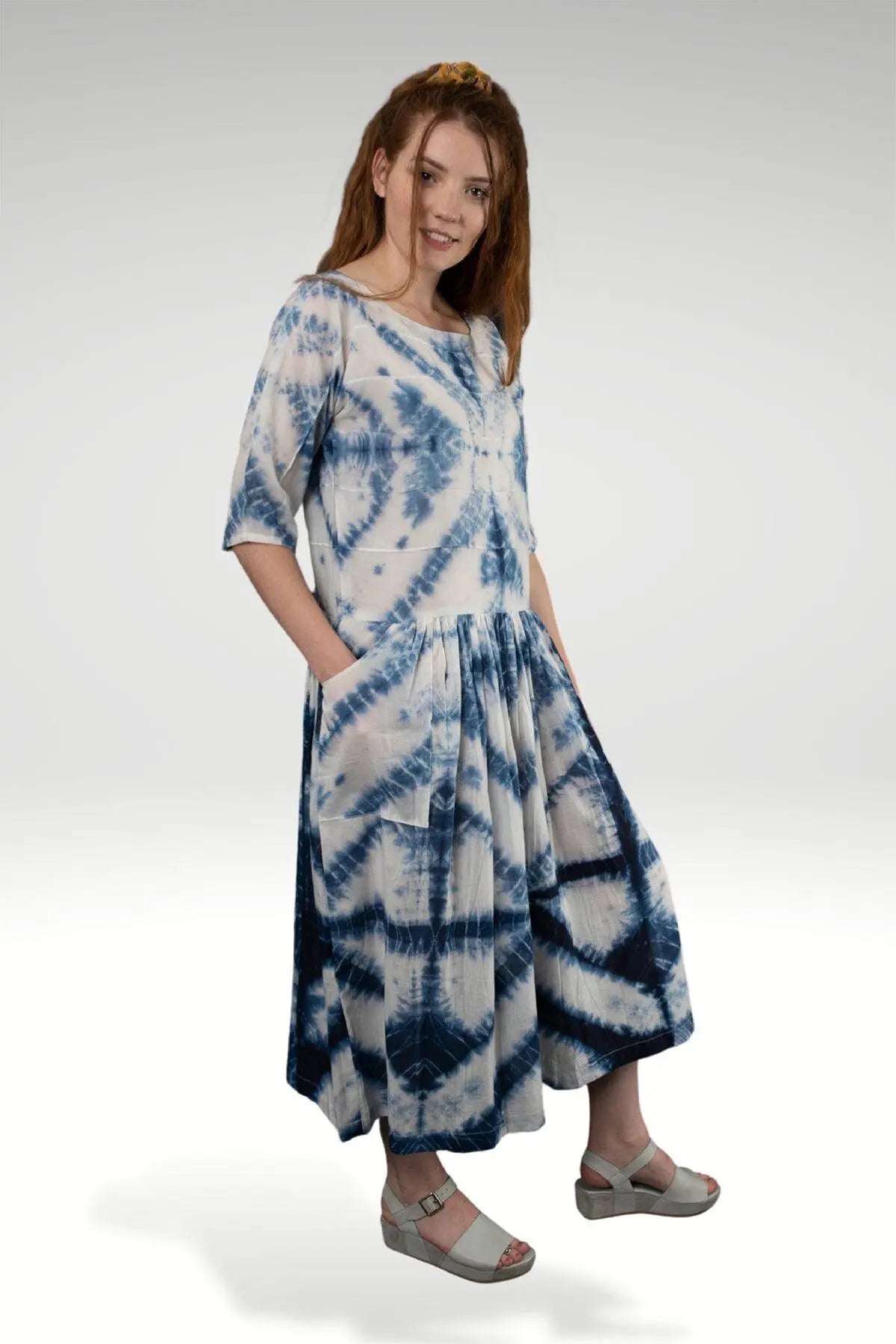 NOREEN SHIBORI DRESS - zohaonline Model posing in this tie and dye dresss with hands in pockets