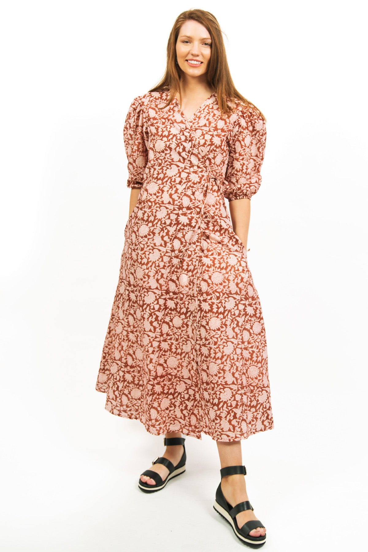 MODEL POSING IN ZEPHYR PRINTED WRAP MAXI DRESS AMBER COLOURWAY- zohaonline