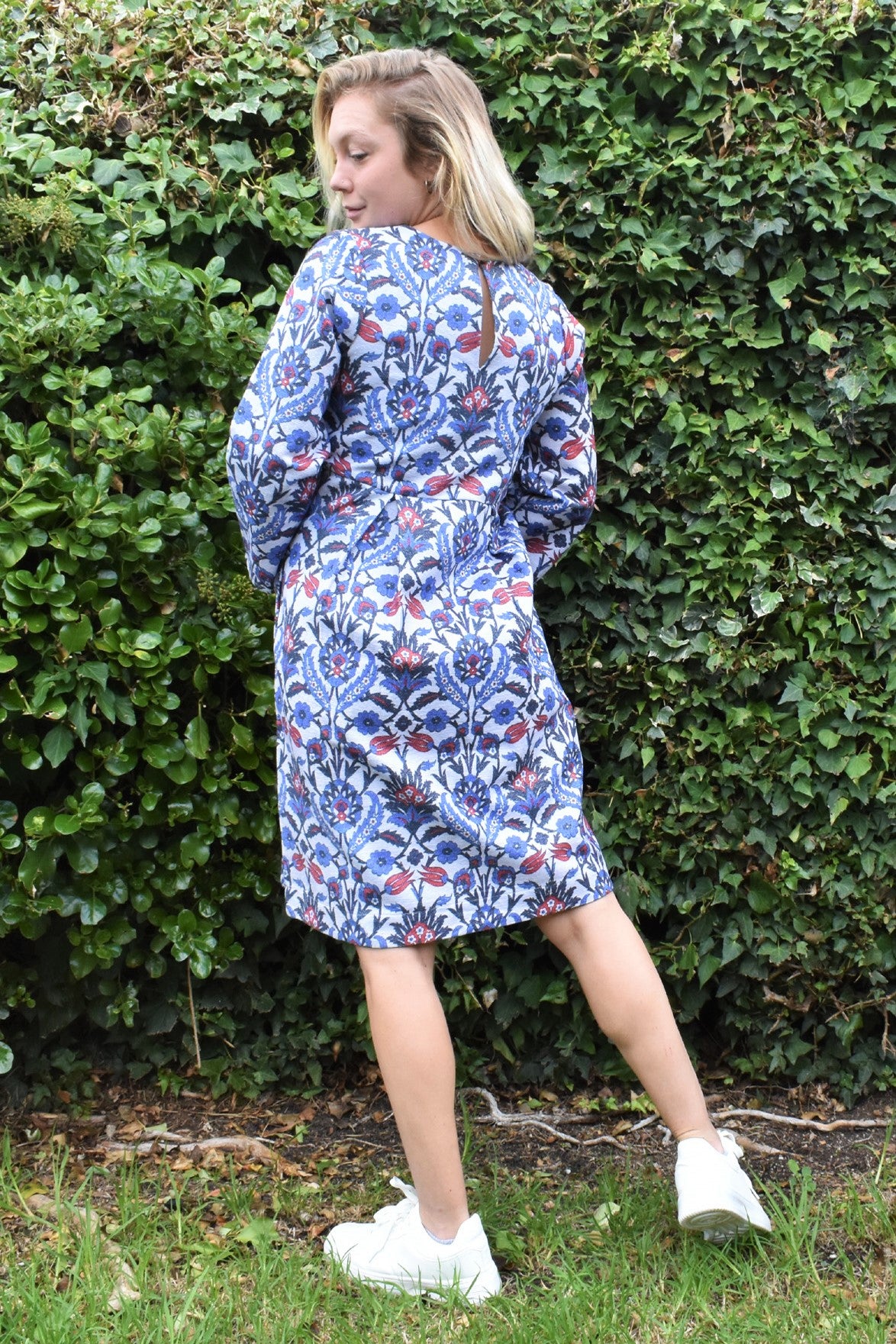 LUNA LUREX PRINTED FLORAL DRESS -BACK VIEW ON MODEL IN NATURAL SETTING- zohaonline