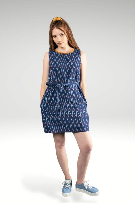FRONT VIEW OF FIDA IKAT SHIFT DRESS WITH POCKETS AND BELT - YELLOW TRIM ON NECK WITH EMBROIDERY STITCH DETAIL zohaonline