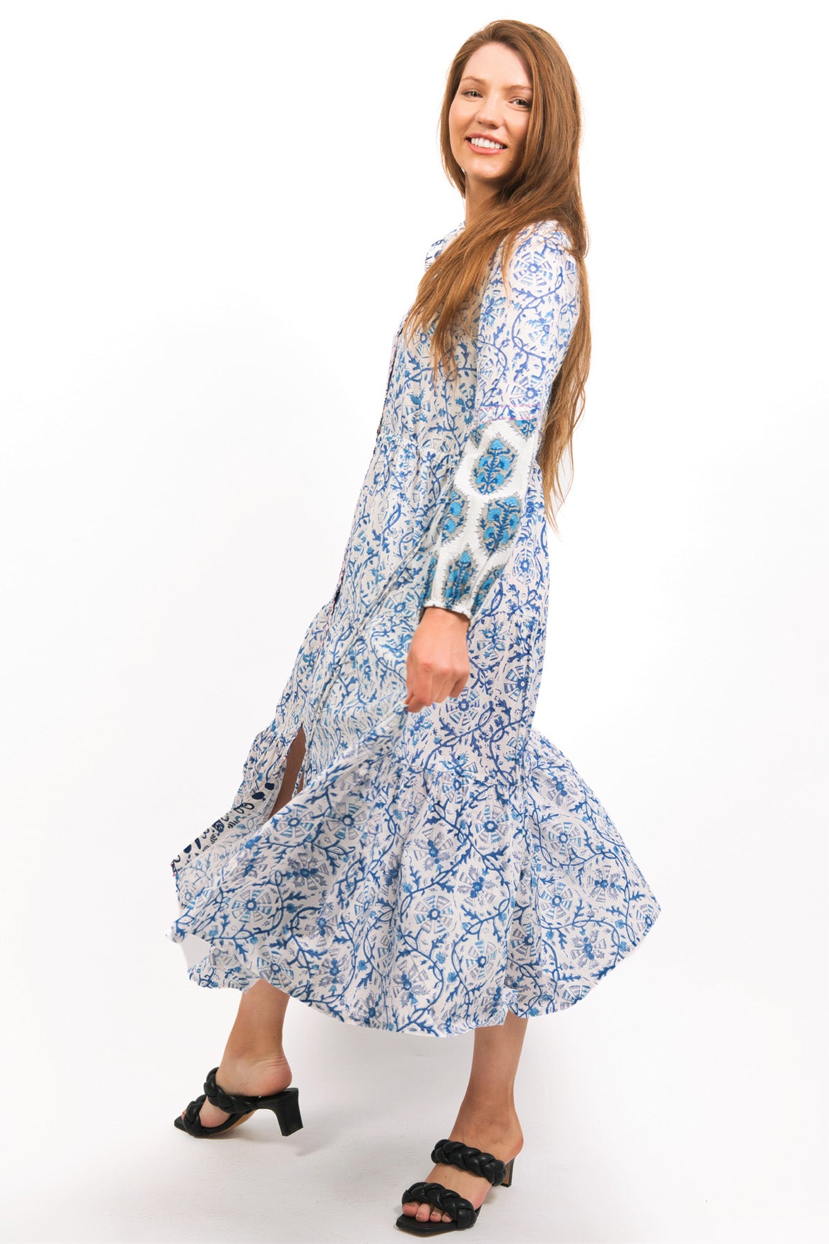 MODEL SHOWING OFF FLARED IRIS PRINTED TIERED MAXI DRESS - zohaonline