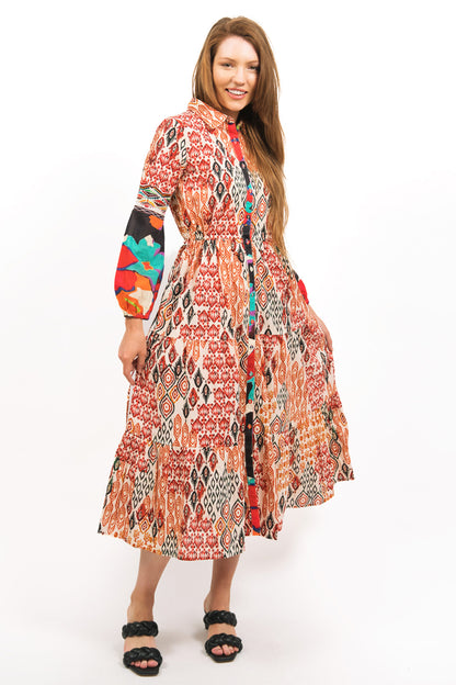 model showing off the flowing TOZI PRINTED TIERED MAXI DRESS with long sleeves and front button opening- zohaonline